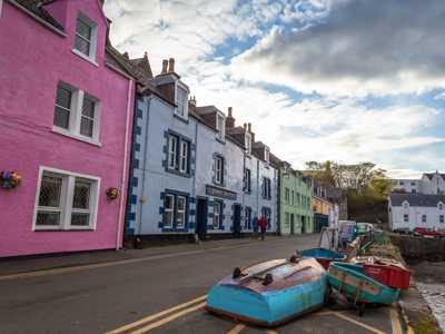 colourful front of restaurants and shops in Portree harbour, Isle of Skye's capital town