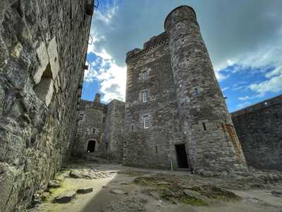 Blackness Castle inner courtyard with rugged stone walls and peaceful atmosphere